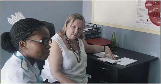 Figure 4. An international clinical expert under the NNHF project discussing a patient with a nurse in the new hemophilia clinic.