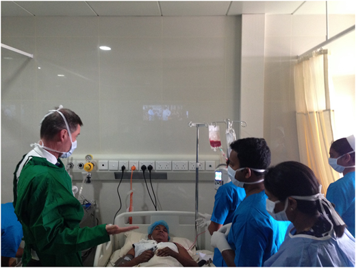 Staff discussing procedure with first patient.