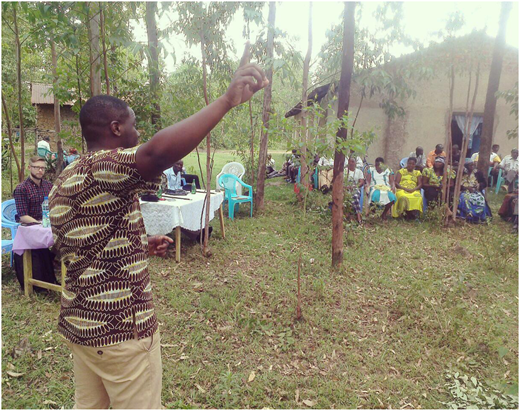 A health care worker giving a talk on sickle cell disease during a support group meeting in western Kenya.