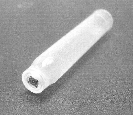 Figure 5. A small RFID chip on the bottom of a test tube. (Photo courtesy of Maxell Corp.)