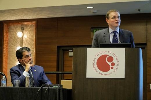 Chair of the Committee on Government Affairs Dr. Alan Rosmarin (left) listens to Dr. Jason Westin (right) speak at the 2018 Grassroots Network Lunch in San Diego.