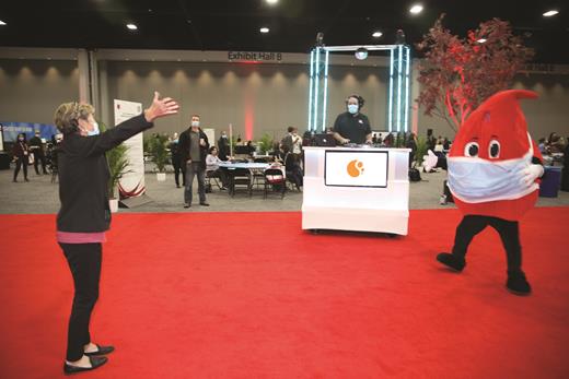 The Welcome Back reception mobile DJ provides the soundtrack for a special moment between Red and an attendee.