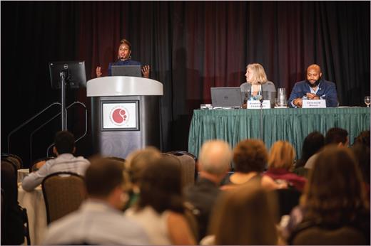 Dr. Veronica Gillespie-Bell speaks during the 2022 Grassroots Network Lunch, joined by panelists Dr. Jennifer Holter-Chakrabarty, Chair of the ASH Committee on Government Relations, and Dr. Chancellor Donald, Chair of the ASH Committee on Practice.