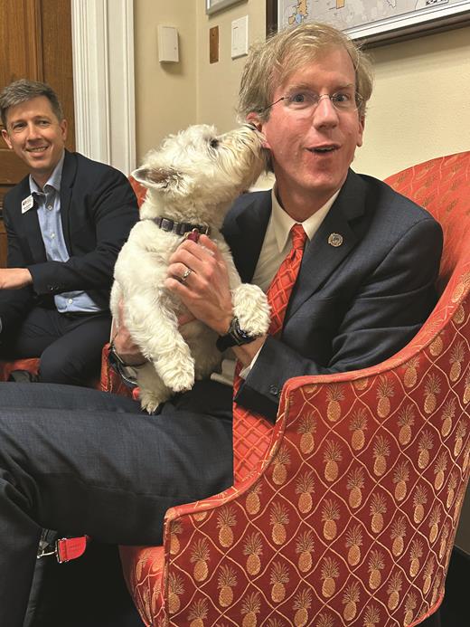 John Burke, MD, vice chair of the ASH Committee on Practice, greets Fiona, the “pawlicy advisor” for Rep Diana DeGette (D-CO).