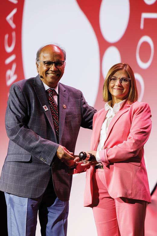 Mohandas Narla, DSc, the 2024 ASH president, passes the gavel to Belinda Avalos, MD, the 2025 ASH president.