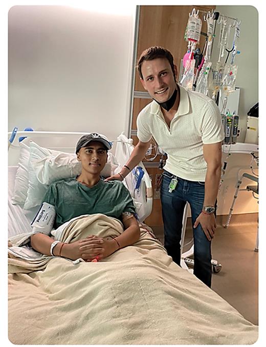 Matt, right, visits Rohan during his cord blood stem cell infusion.